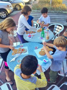 Kids decorating gingerbread cookies